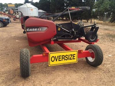 Photo 4. Case IH 3016 pickup Windrower Front