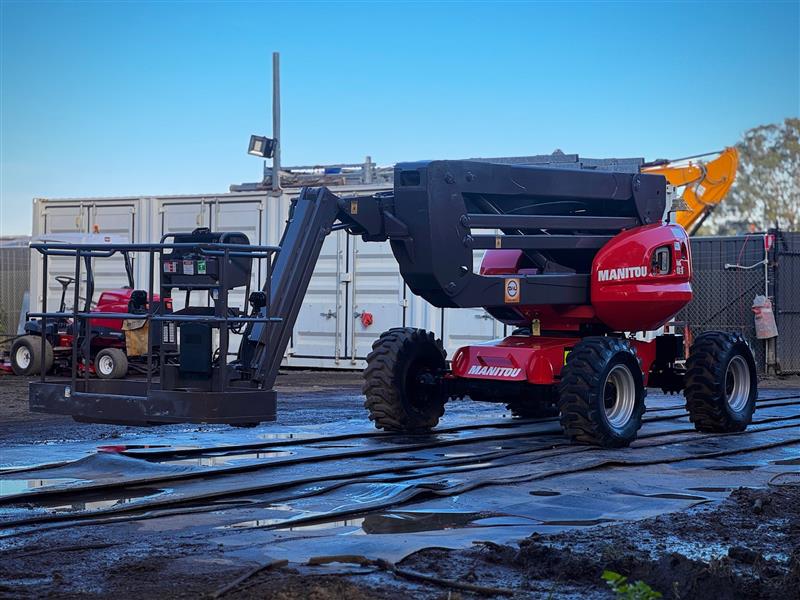 Photo 2. Manitou 160 ATJ all terrain boom scissor lift elevated work platform