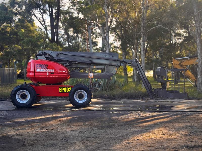 Photo 3. Manitou 160 ATJ all terrain boom scissor lift elevated work platform