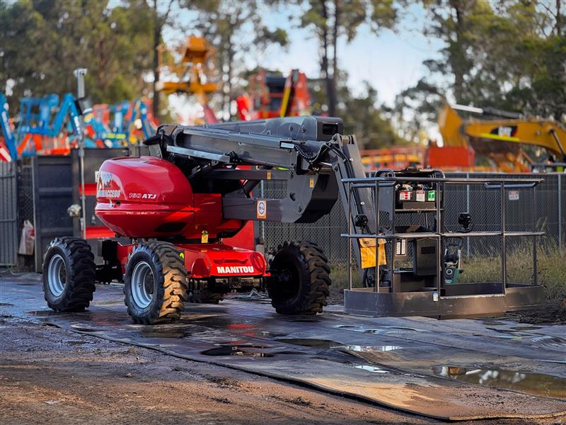 Photo 4. Manitou 160 ATJ all terrain boom scissor lift elevated work platform