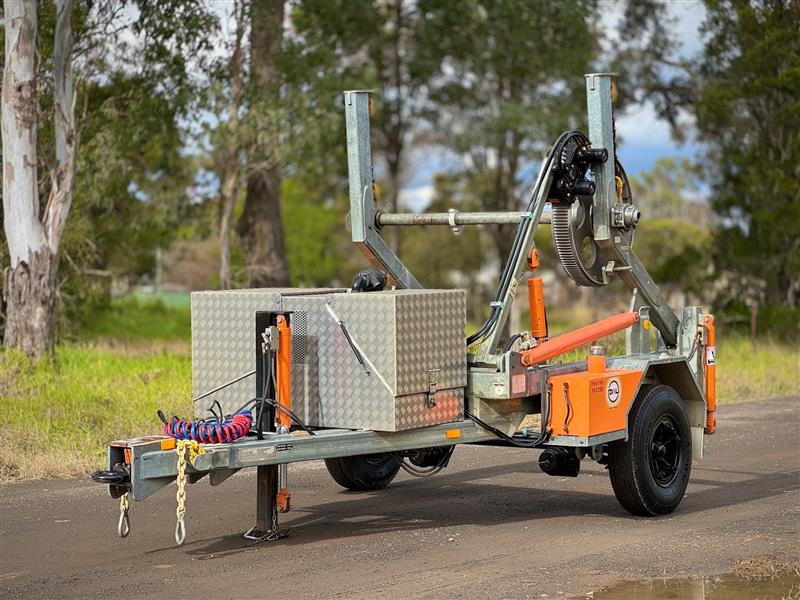 Photo 4. Redmon Gray 5T self loading calbe drum trailer