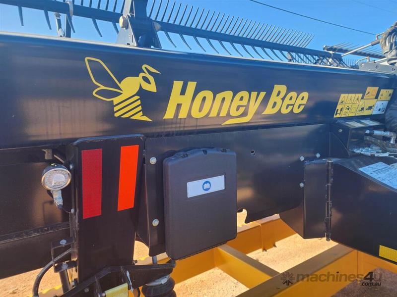 Photo 1. Honey Bee RDX 40' harvester Front