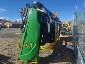 Photo 1. John Deere 420D windrower
