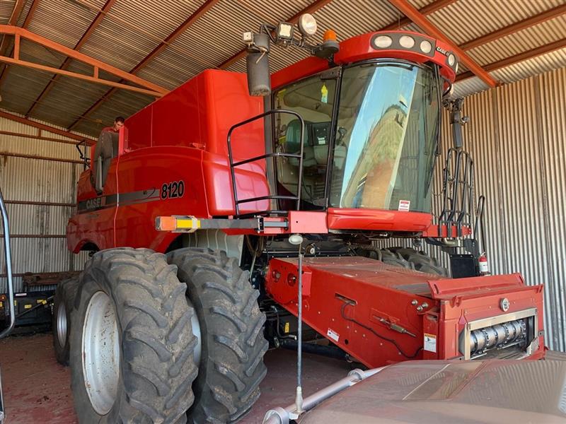Photo 1. Case IH 8120 with 45FT 2152 and trailer combine harvester