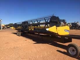 Photo 1. New Holland 840CD-45 Front with Trailer