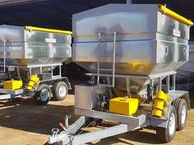 Photo 1. Commander Ag-Quip Feedout Carts