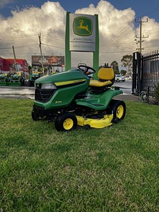 Photo 1. John Deere X324 ride on mower