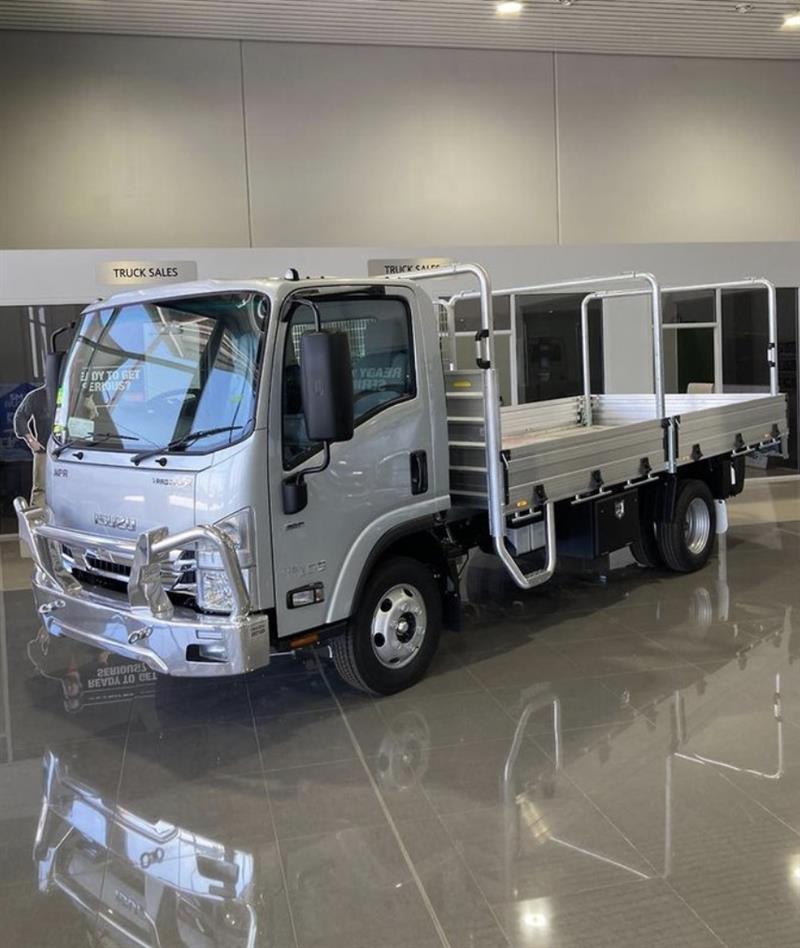 Photo 1. Isuzu NPR 45/55-155 AMT MWB tradepack tray truck