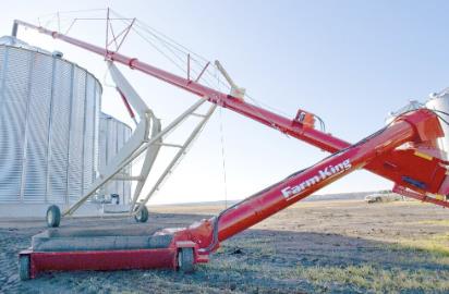 Photo 1. Farm King Swing Away Grain Augers