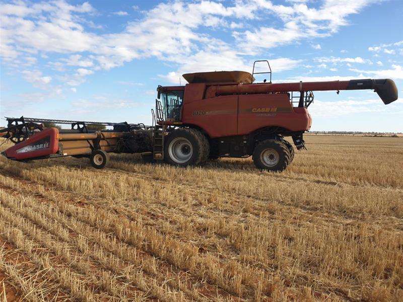 Photo 2. Case IH 8120 Axial Flow Combine with 2009 Case IH 2152 draper front 45ft