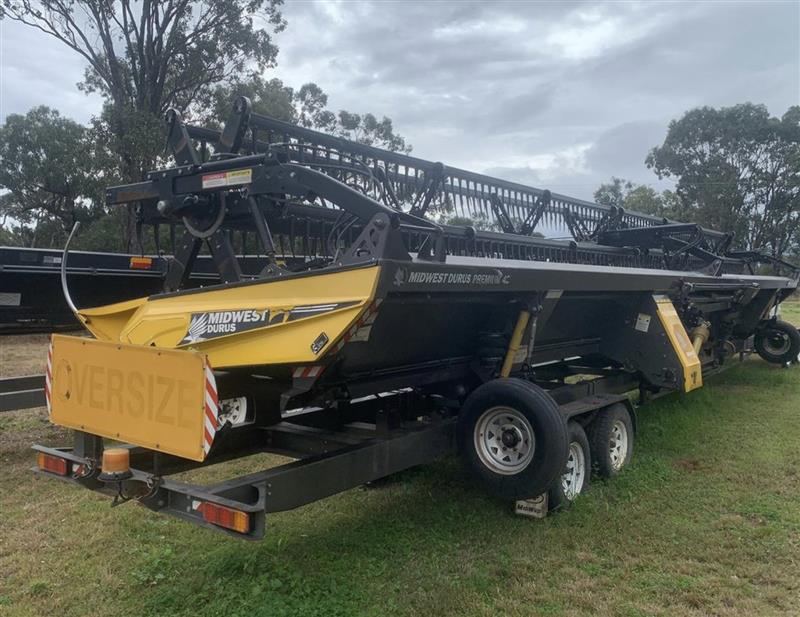 Photo 2. Midwest Durus 42ft harvester front