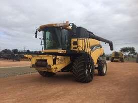 Photo 2. New Holland CR960 combine harvester with 39 honey bee front