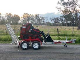 Photo 3. Toro TX1000 Skid Steer Loader