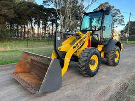 Photo 2. New Holland W80C Loader