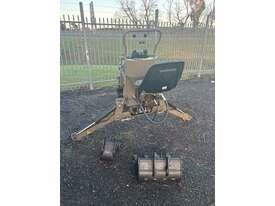 Photo 2. Titan F100 Cut Attach backhoe attachment