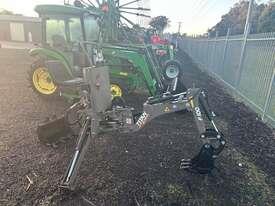 Photo 3. Titan F100 Cut Attach backhoe attachment