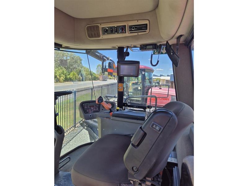 Photo 2. MacDon M155 windrower